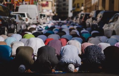 people kneeling and praying during daytime