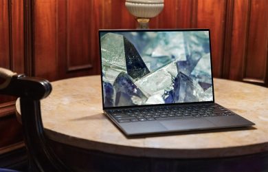 laptop on brown wooden table
