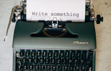 black and white typewriter on green table