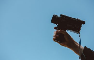 person holding video camera
