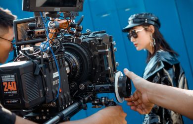 Photo Of Men Holding Camera