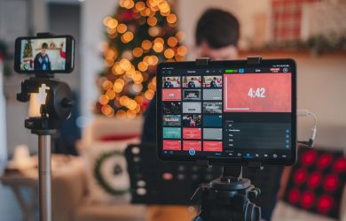 black smartphone taking photo of yellow round fruits