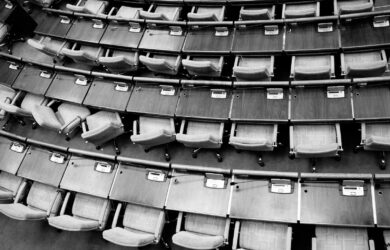 brown wooden chairs on gray concrete floor